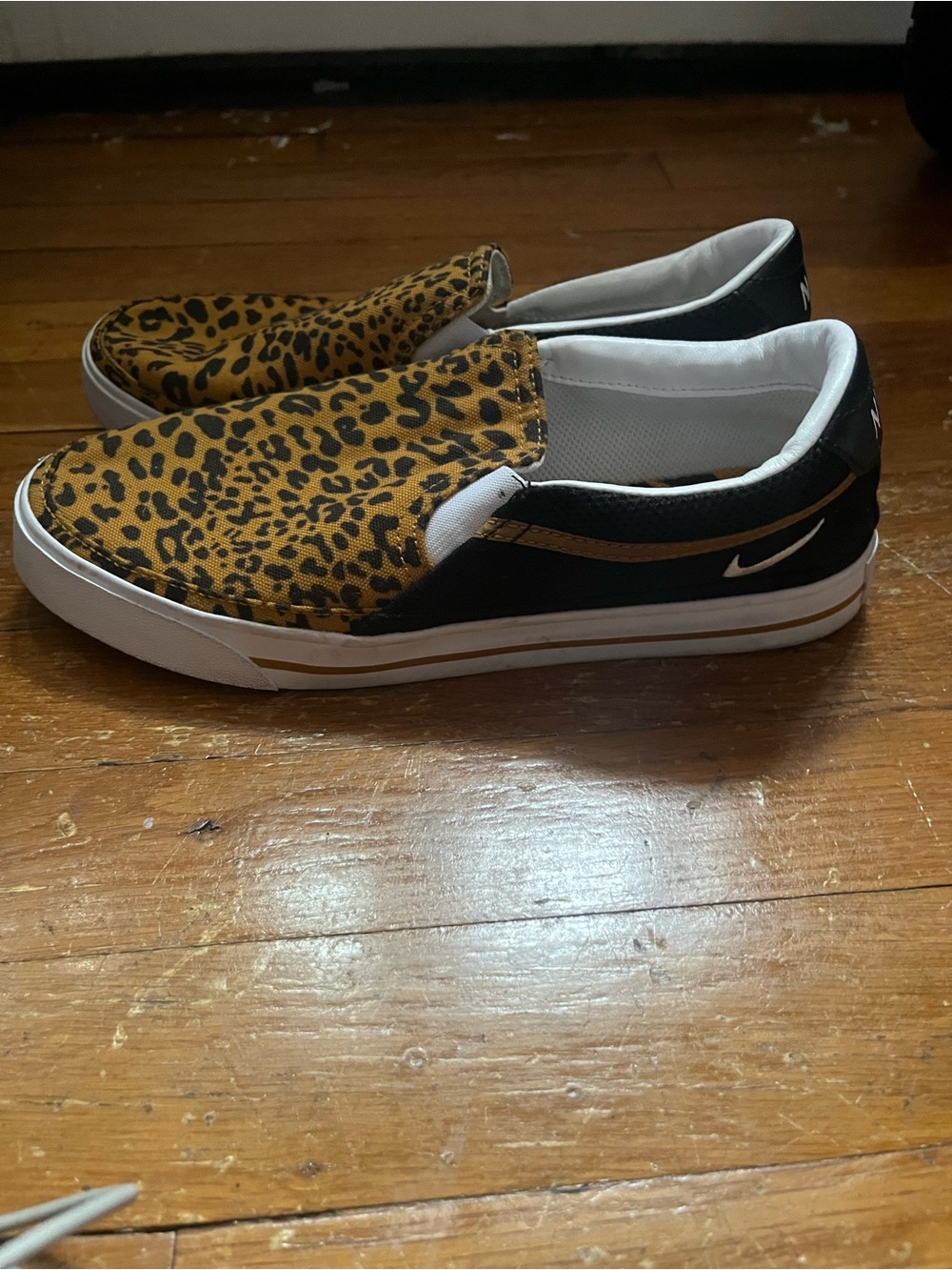 Nike Women Slip-On Sneakers in Leopard Print and Black with White Sole